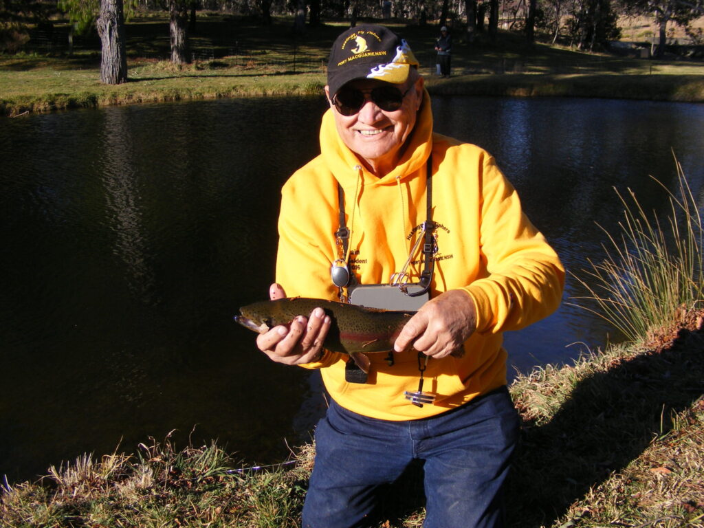 The one that didn't get away - President Iain with his trout caught during the trout fry release
