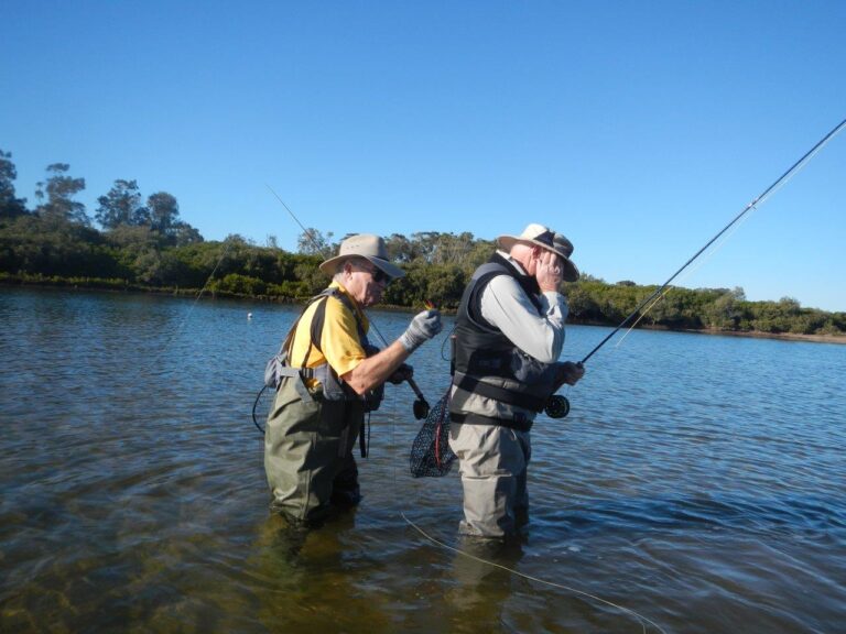 Hmm, is the Pres poking the VP with a fly or perhaps helping him to extract a fly from his vest that he accidently hooked himself with? You decide!