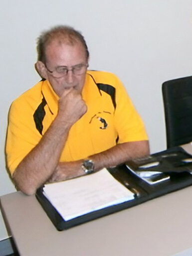 A thoughtful Phil sitting at the Club Secretary's chair, February 2014 meeting