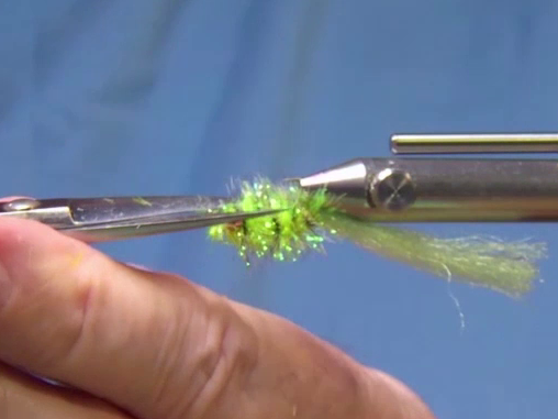 Comb out the poly yarn. 
Clear cut the bottom of the fly.