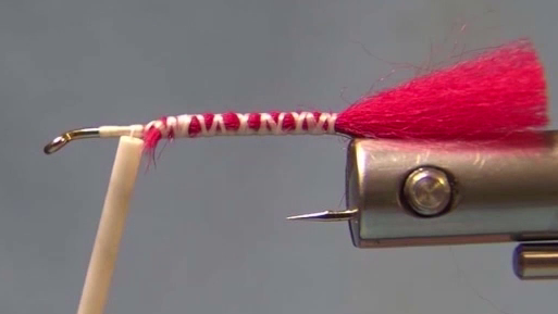 1. Cover the hook with thread.
2. Tie in the red soft fibre to 3/4 length of the hook.