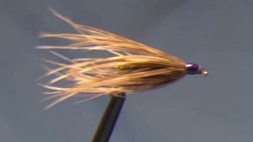 Train the feathers with your hair dryer.
(Every fly tier should have one!)