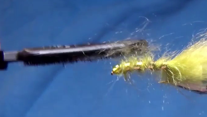 The dubbing has been brushed out with Velcro to create a bushy, lifelike body. Fine fibres splay outward along the length of the fly, giving it a soft and buggy profile.