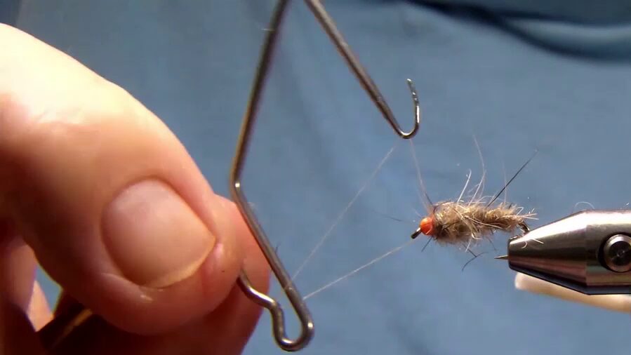 Fly tied off with whip finish behind the bead.
