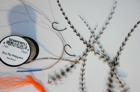 Materials for Fed’s Poly Yarn Parachute Caddis dry fly, including poly yarn, hook, and tying supplies