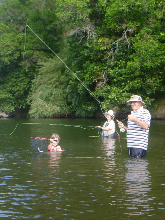 Hastings Fly Fishers. Ron and Dawn with grandson Henry the expert netter.