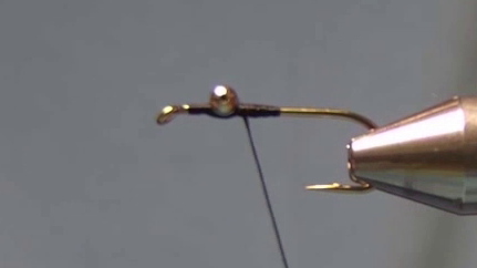 Hook shank half-covered with thread, dumbbell eyes secured two eye-lengths back from the hook eye.