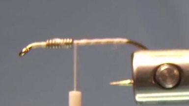 Hook shank covered in thread with lead-free wire wraps visible, stopping one eye-length behind the hook eye.