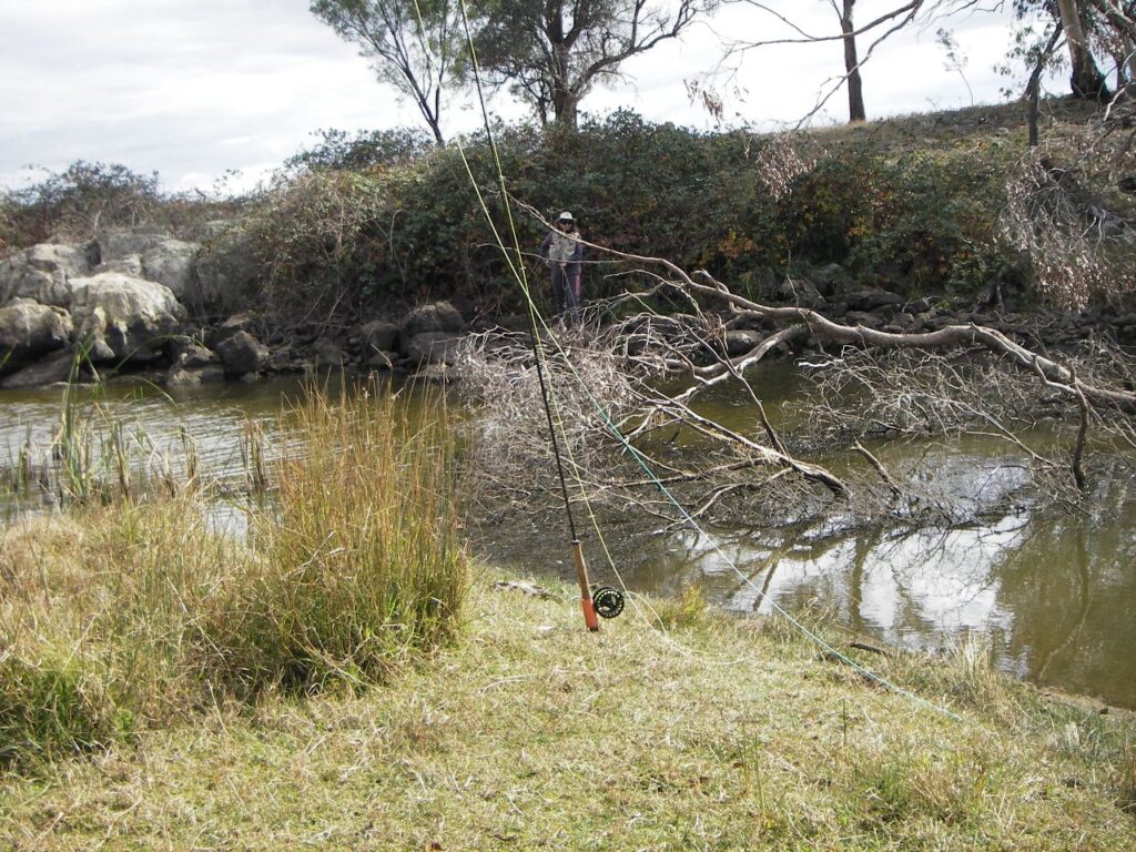 Tony Bendeich's rod holder came in handy as the 'nice sheriff' helped Iain net another Rainbow