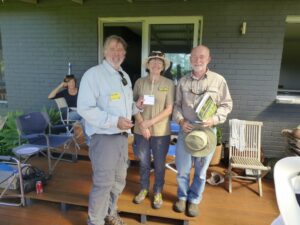 Dawn presenting Peter and Brian with a thank you from club members