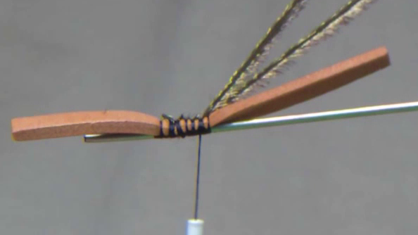 2mm foam strip is tied in at the post alongside the thread, forming the foundational structure for the detached fly body.