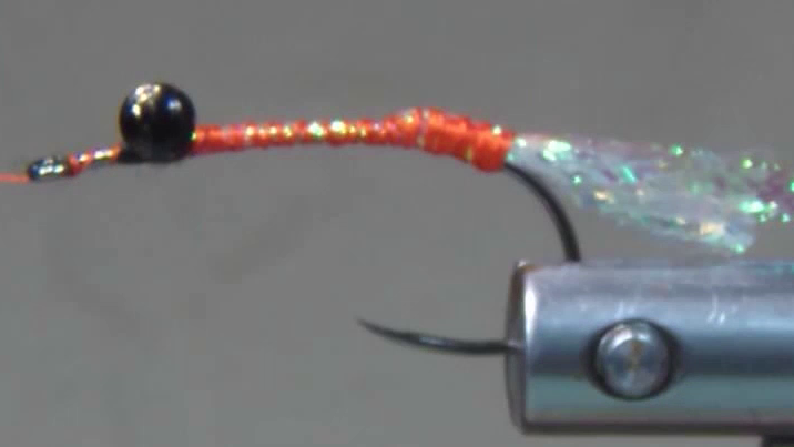 Medium pearl E-Z Body tail tied in at the hook bend, with FF Braid Shrimp material secured and ready to form the body.
