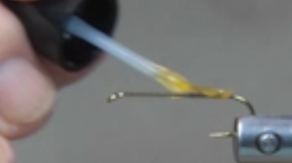 Hook secured in vise and Sally Hansen’s Hard as Nails applied.