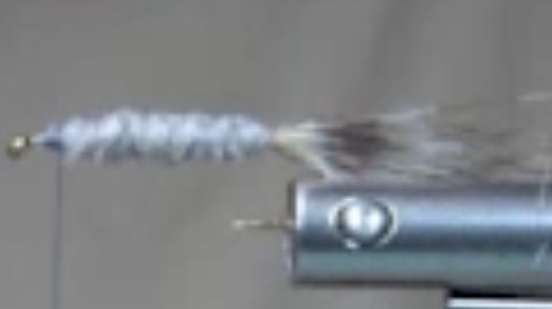 Twine strip wrapped to form a body, tied of and secured.