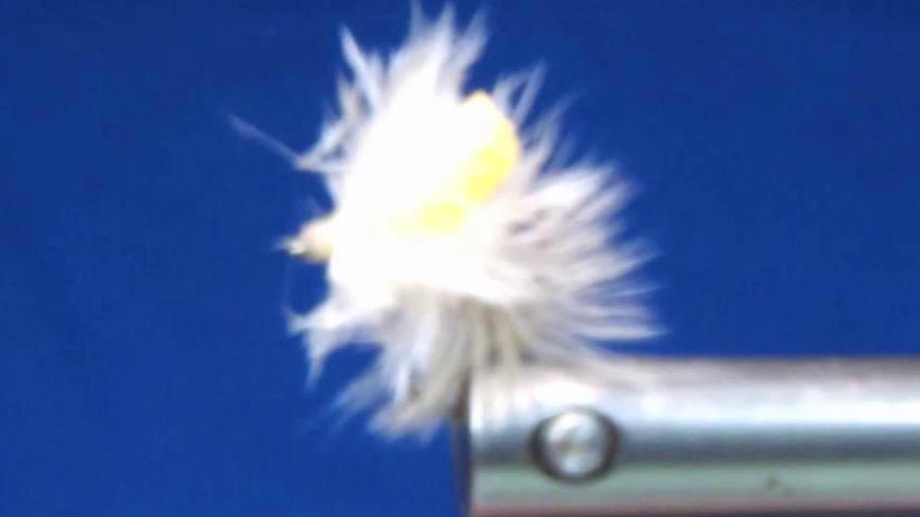 Completed Fed's Carp Dry Fly Variant featuring a dense white hackle body, upright yellow foam post, and neatly finished thread head with a glossy coating.