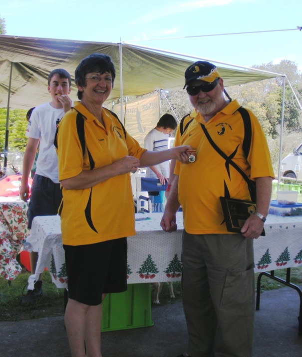 President Dawn presenting Bob's with his Life Membership badge
