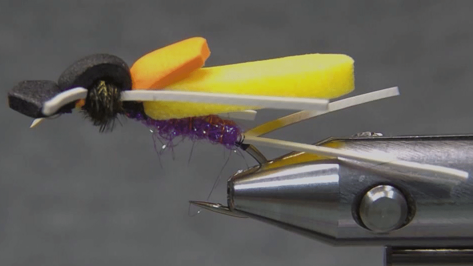 Finished Timber Ant foam fly viewed from the side, showing its angled profile and layered foam construction.