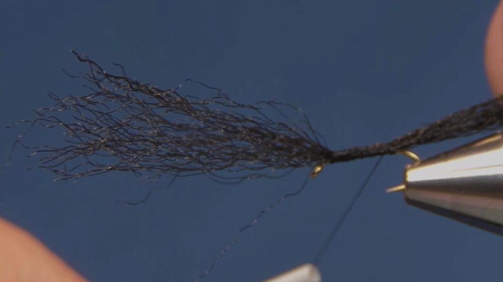 Black Congo Plus secured along the hook shank and trimmed to form the short tail.