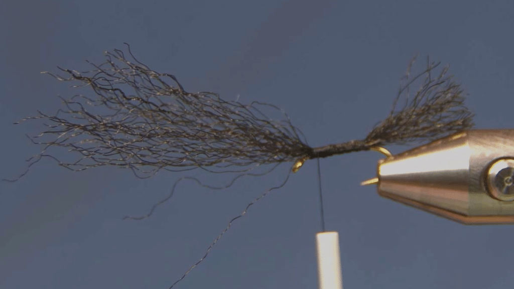 After Step 6: Thread returned to the eye with the second strand of black Congo Plus tied in to form the wing.